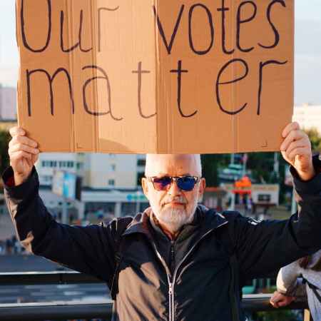 protester holding sign