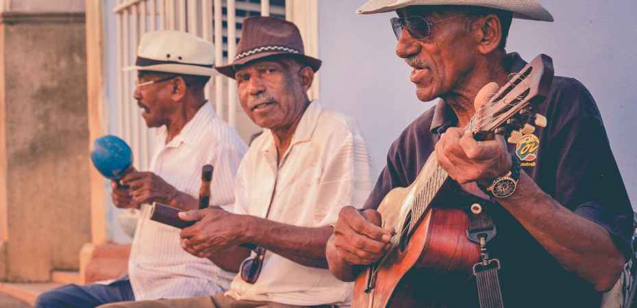 three men playing musical instruments