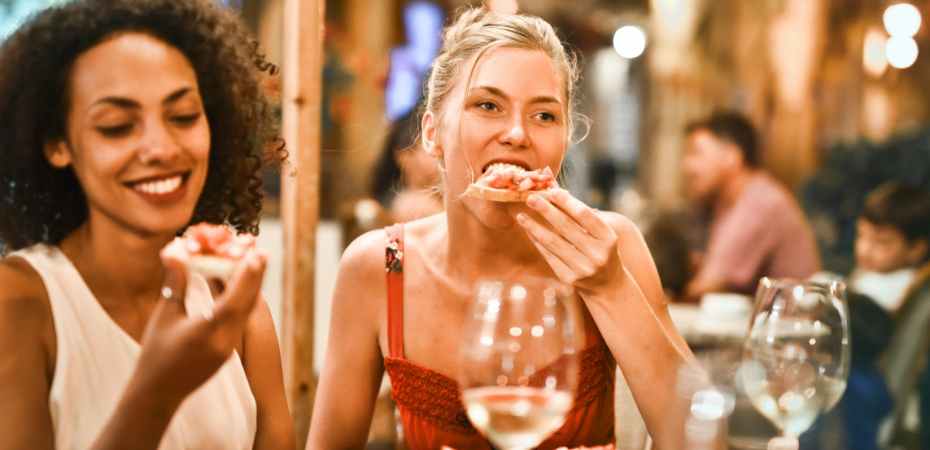 woman eating bruschetta